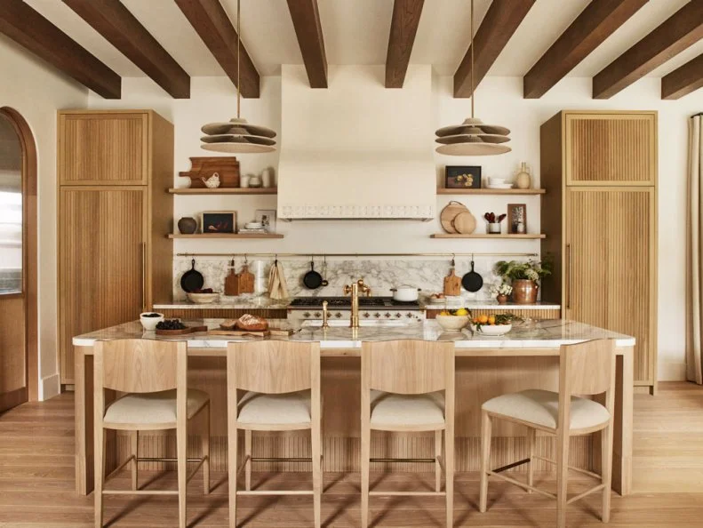 Spanish-Style Kitchen With Expansive Island and Exposed Wood Beams