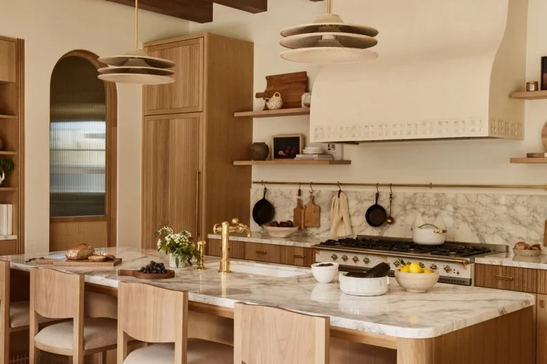 Spanish-Style Kitchen With Plaster Hood and Funky Pendants