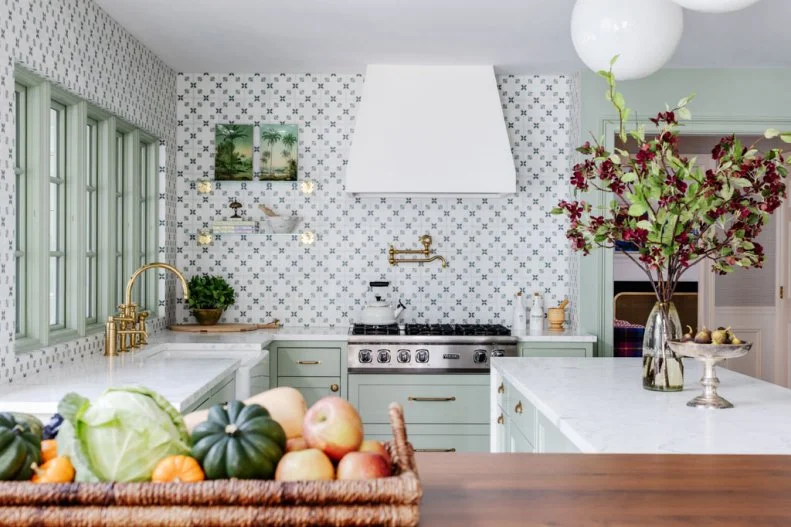 Country Kitchen With Sage Green Cabinets and Hand Stamped Backsplash