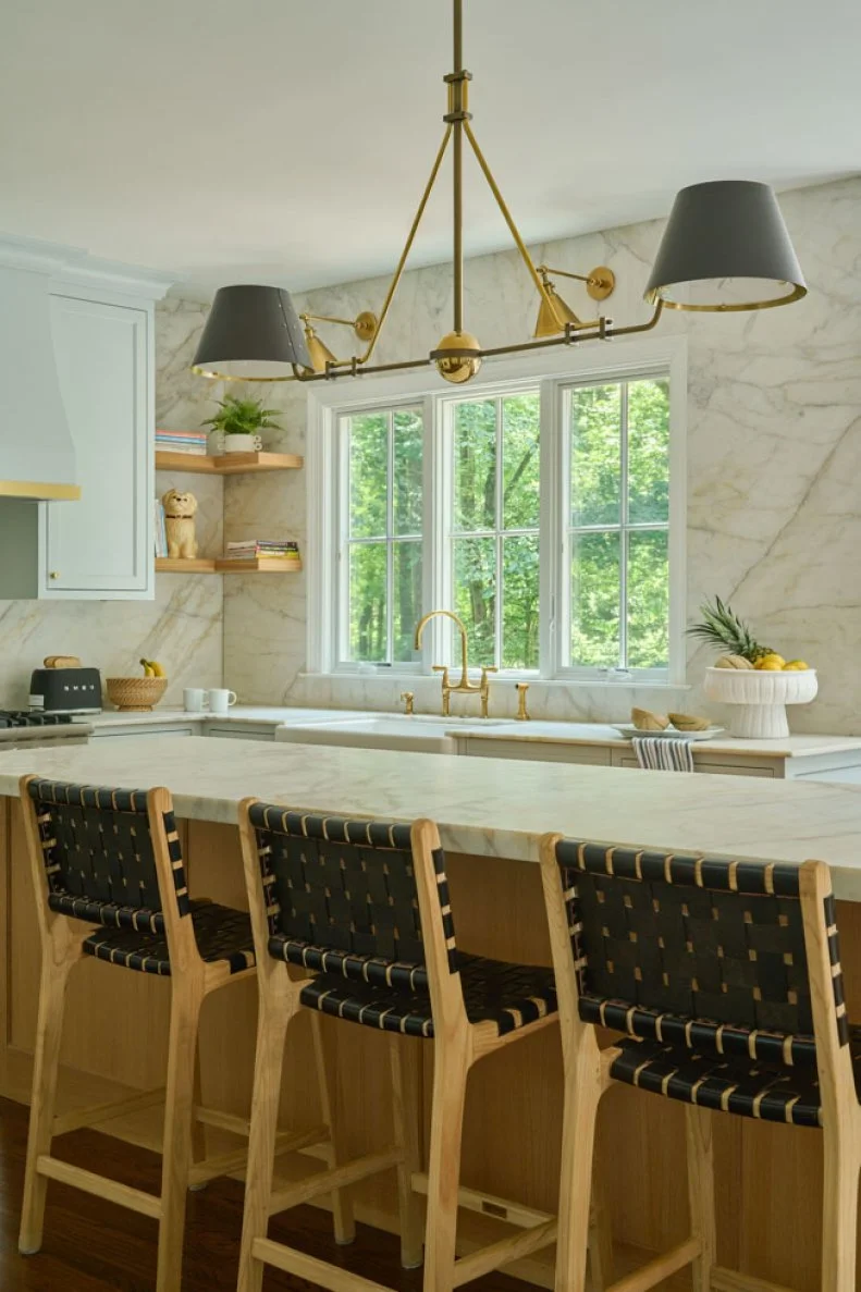 Three Barstools at White-Marble-Topped Kitchen Island