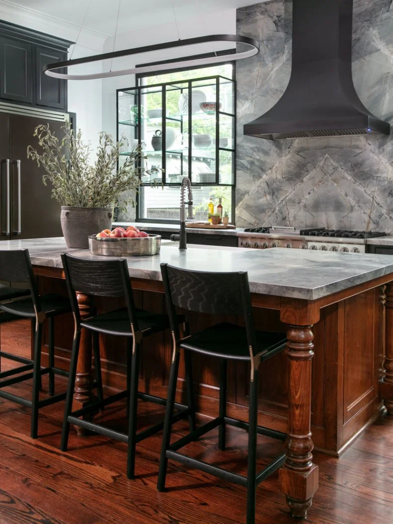 Marble-Topped Island With Barstools in Neutral Transitional Kitchen