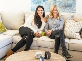 Christina Anstead and Cassie Zebisch in the living room of the completed remodel of her long-time friend Cassie Zebisch, as seen on HGTV’s Christina on the Coast.