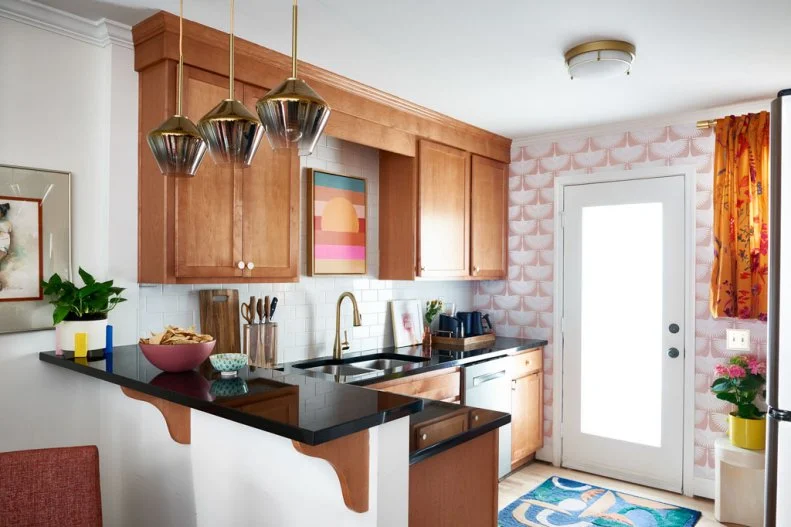 Colorful Kitchen With Wood Cabinets and Black Countertops