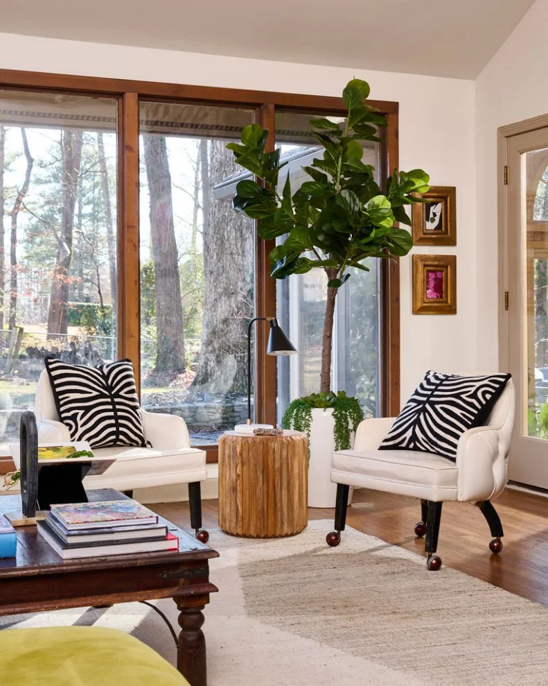 Chairs With Zebra-Print Pillows in Neutral Transitional Living Room