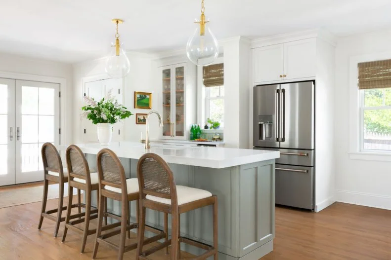 Four Wicker-Backed Barstools at Island in White Transitional Kitchen