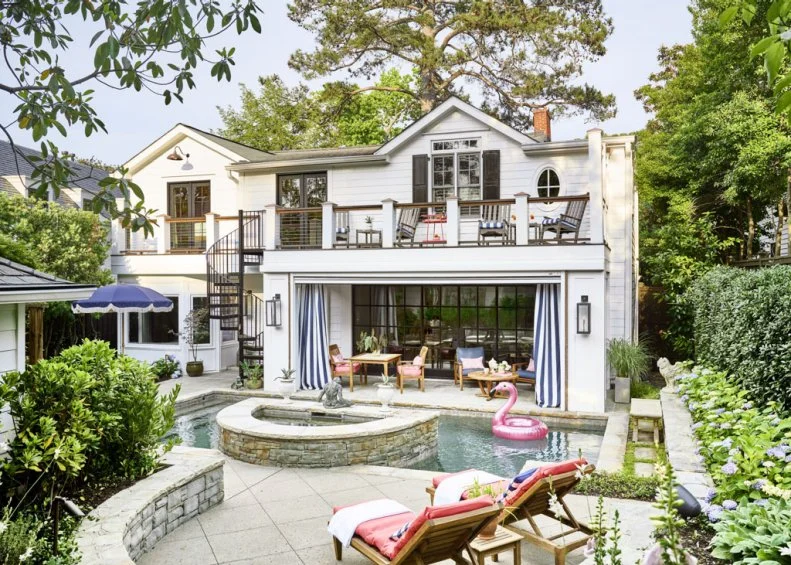 Rear Exterior View of White House With Backyard Pool