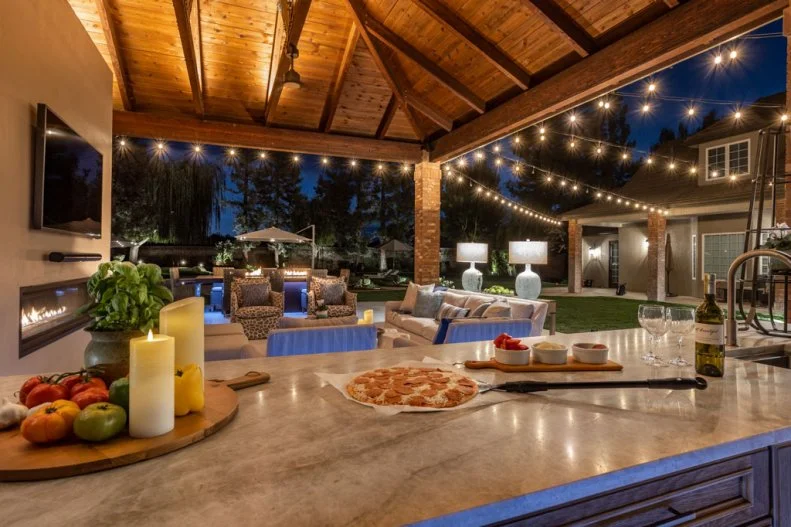 View From Outdoor Kitchen of Adjacent Pergola-Covered Patio