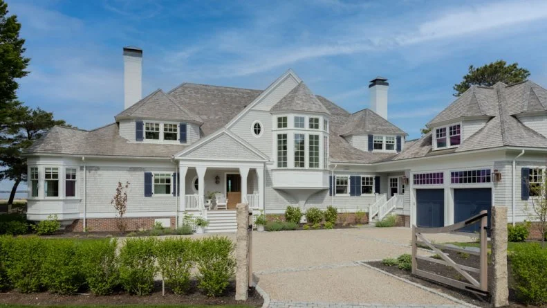Front Exterior View of Neutral Shingle-Style House
