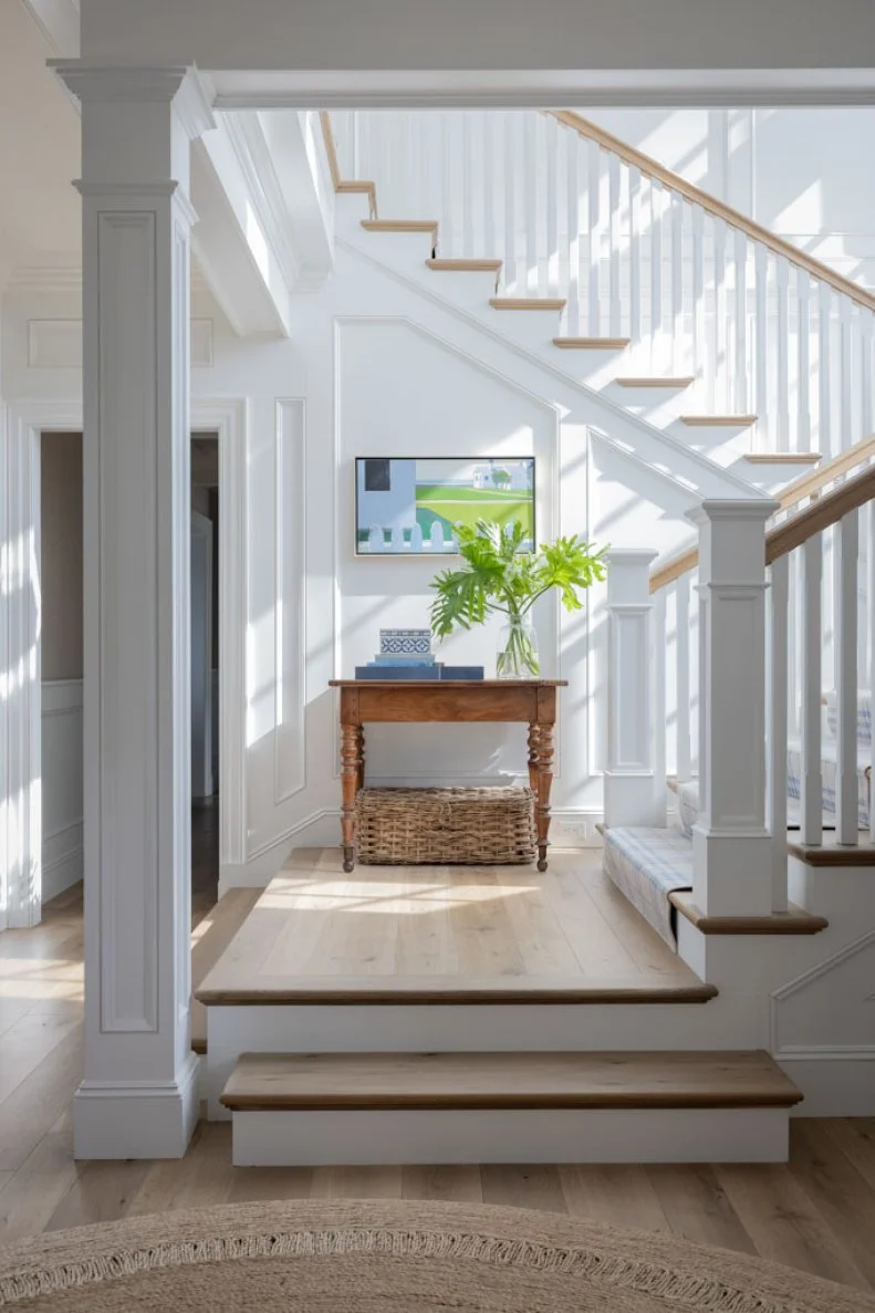 Column at Wood Staircase Landing With Table