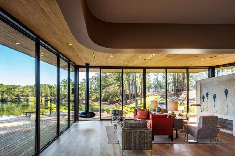 Curved Ceiling in Neutral Contemporary Living Room With Lake Views