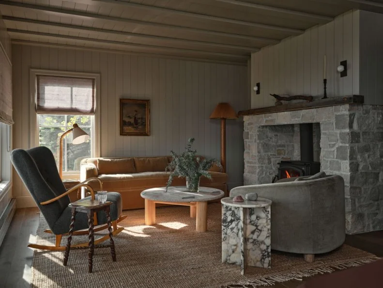Rocking Chair and Low-Backed Sofa in Neutral Transitional Living Room