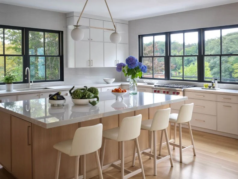 Four Barstools Lined Up at Light Wood Kitchen Island