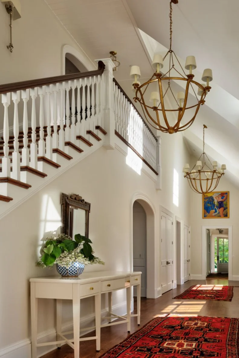 Red Patterned Runners in Neutral Transitional Hallway