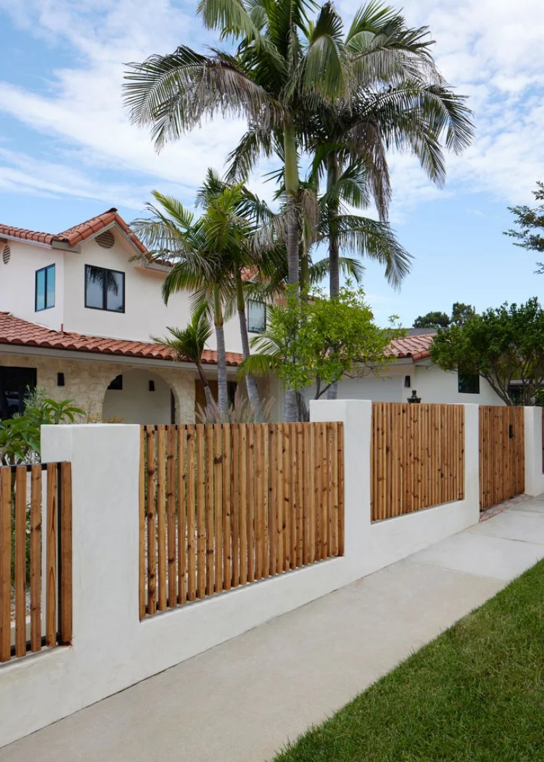 Spanish-Style Home With Wood and Plaster Fence