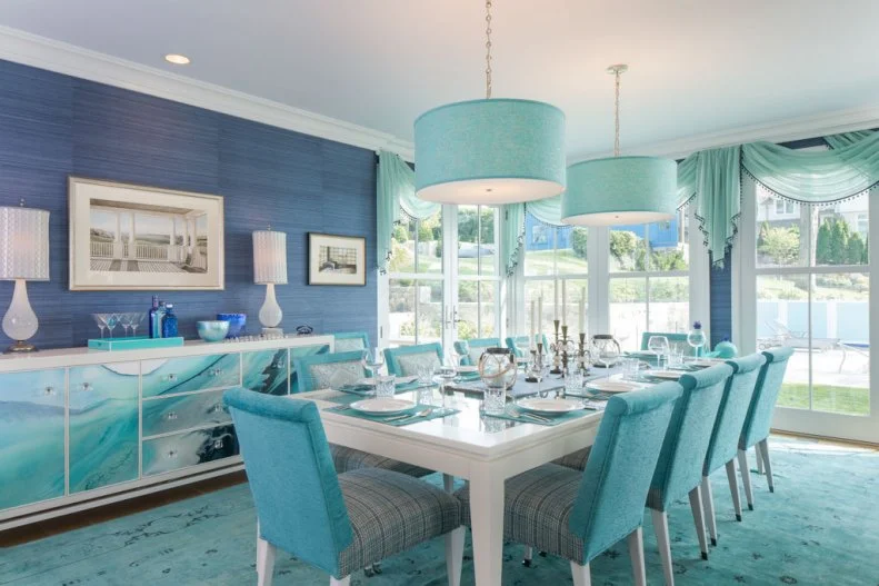 Dining Room With Blue Rug and Wallpaper