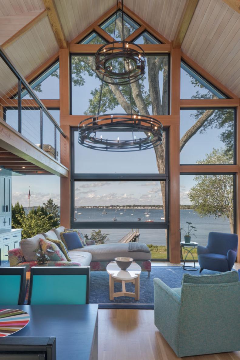 Living Room With Vaulted Ceiling and Water View