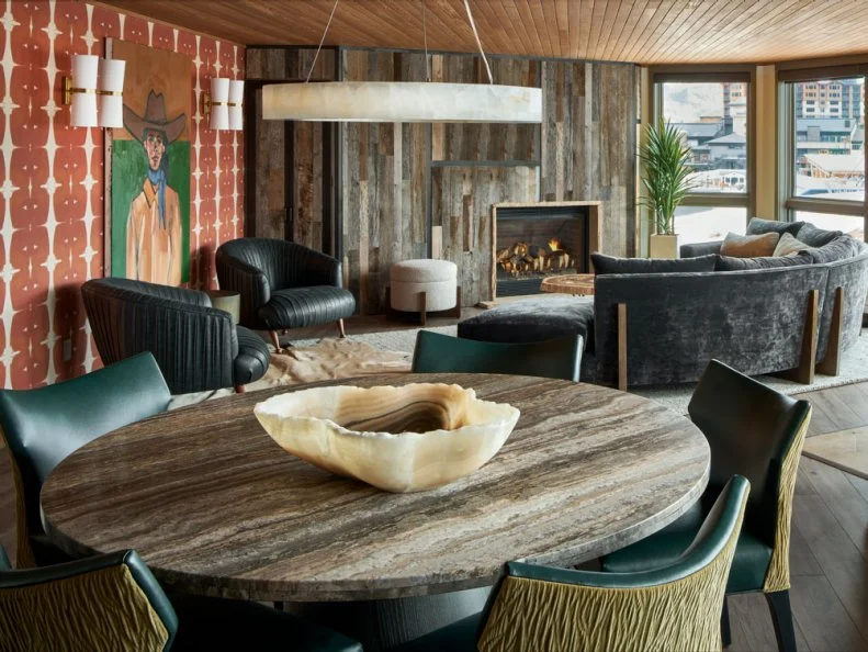 Round Table and Chairs Near Sitting Area With Fireplace