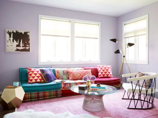 Lavender Family Room With a Multicolor Sofa and Abstract Wall Art