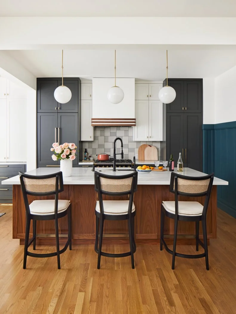 Gray and White Kitchen Wit ha Wood Island and Caned Bar Stools