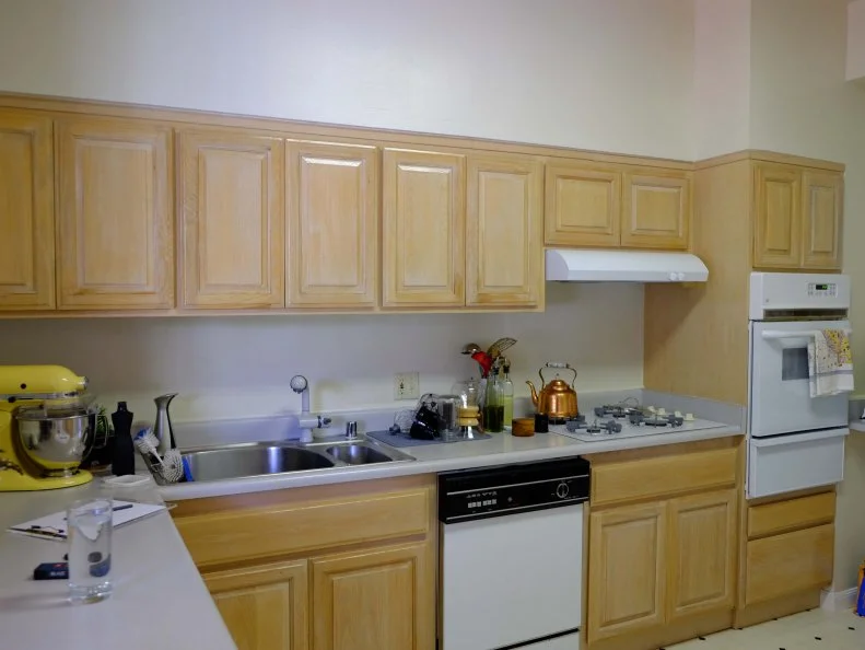 Bland Kitchen With Wood Cabinets and White Appliances