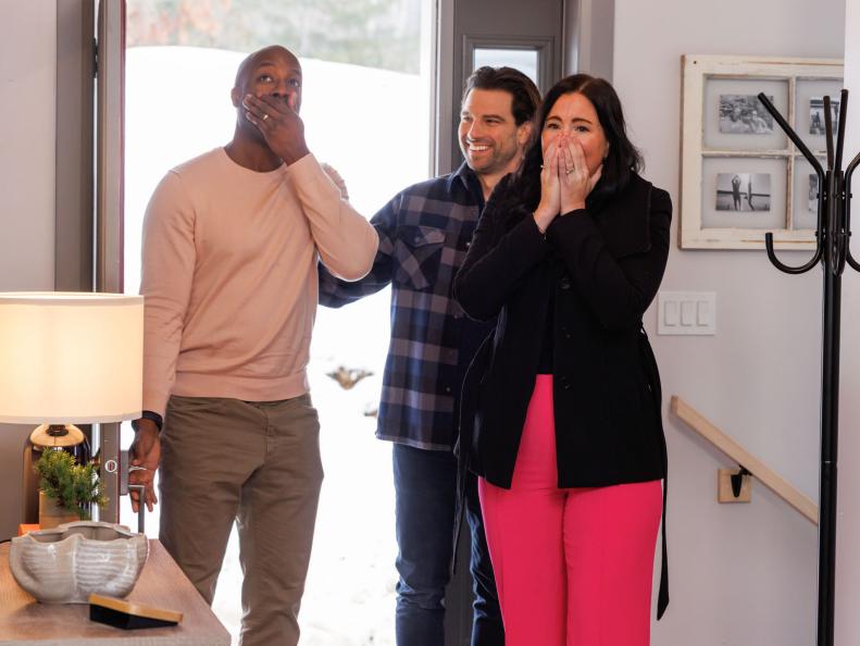 Host Scott McGillivray reveals the renovated house interior to homeowners Emerson and Jillian, as seen on Scott's Vacation House Rules, Season 5.