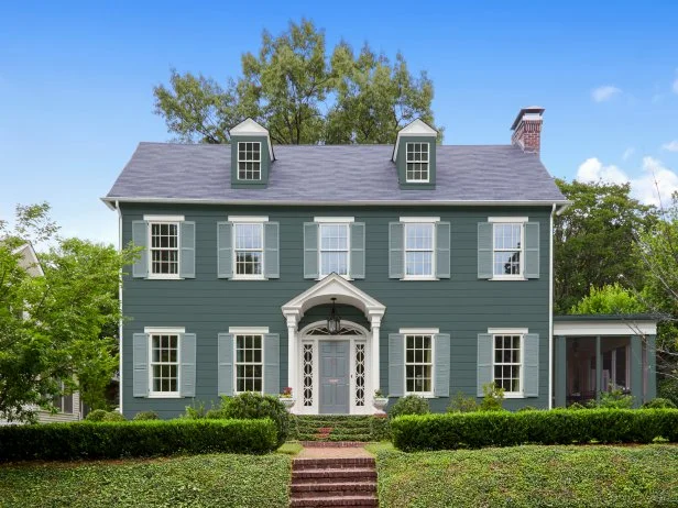 Colonial House With Teal Siding and Muted Blue Shutters