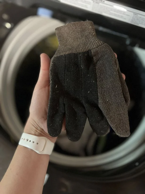 Dirty cotton gardening gloves.