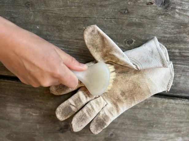 Dirty leather gardening gloves.