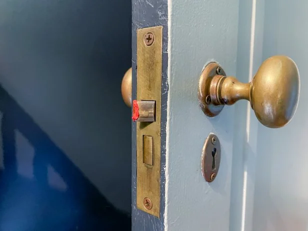 Use bright lipstick to mark your door latch, then close the door.