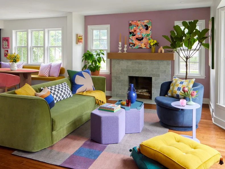 Family Room With Purple Accent Wall and Colorful Furniture and Decor