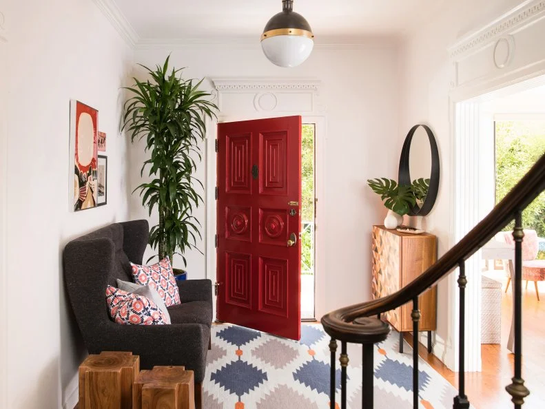 Grand, White Entryway With Traditional Trim and a Red Front Door