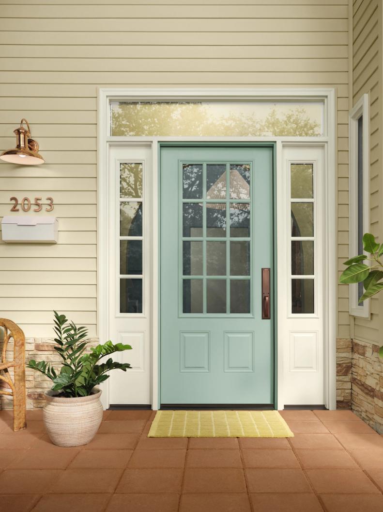 Light Blue Front Door With White Trim and Sidelights