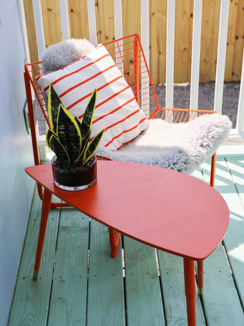 Green Front Porch With Orange Furniture