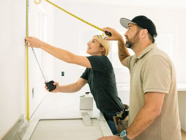 Host Jasmine Roth and Contractor Scott Cross take measurements, as seen on Help! I Wrecked My House, Season 4.