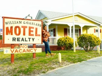 Mika Kleinschmidt in front of The William and Garland Motel, as seen on 100 Day Hotel Challenge, Season 1.