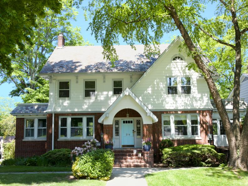 New Jersey Home With Brick, White Siding and a Light Blue Door