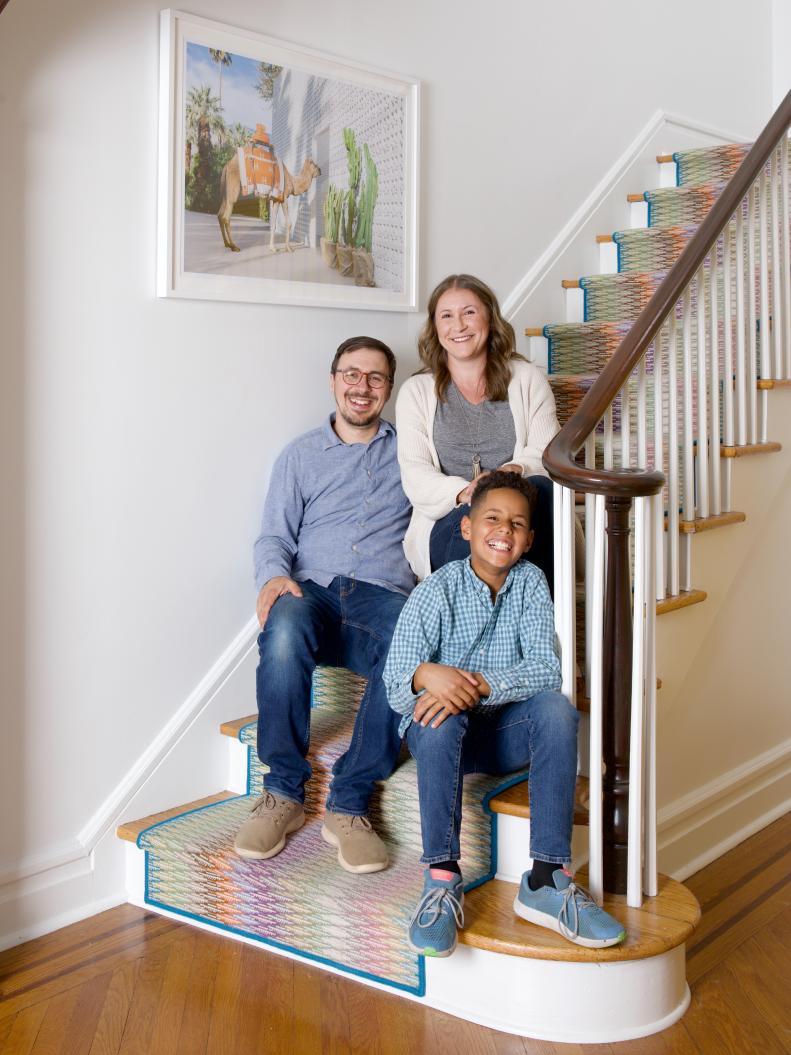 Family on the Steps in Their Eclectic Home