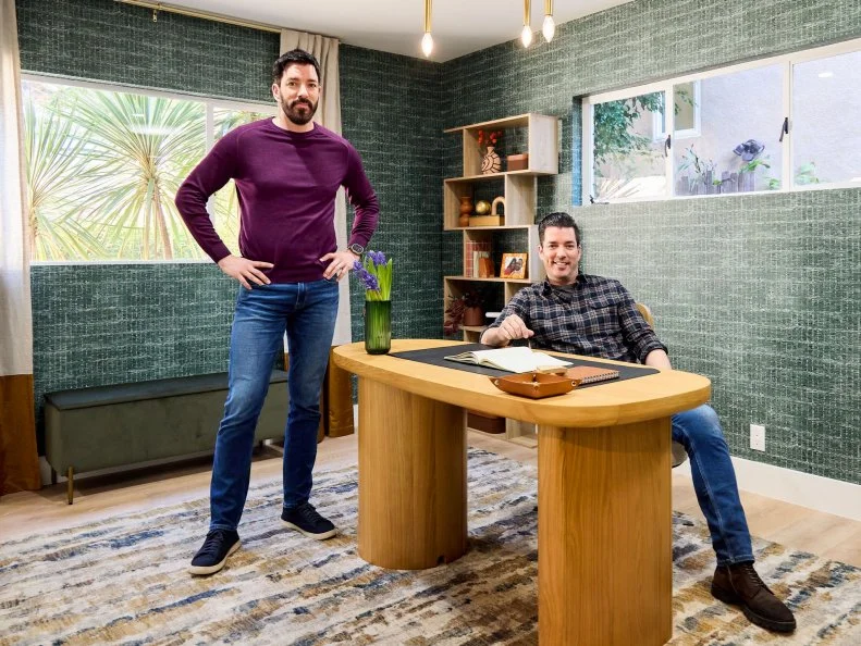 Drew Scott and Jonathan Scott pose in Jessica and Jeff's home office, as seen on Don't Hate Your House with the Property Brothers, Season 1.
