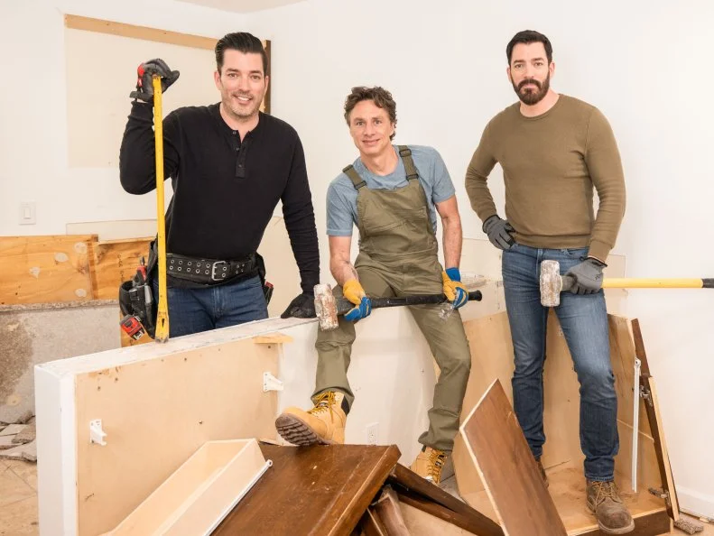Zach Braff, alongside Drew and Jonathan Scott, as they demo the kitchen for Zach's assistant and best friend, as seen on Celebrity IOU.