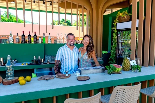 Luke Shantz and Stephanie Sitt portrait in the bar at their renovated hotel in Jaco, Costa Rica, as seen on Betting on Paradise, Season 1.