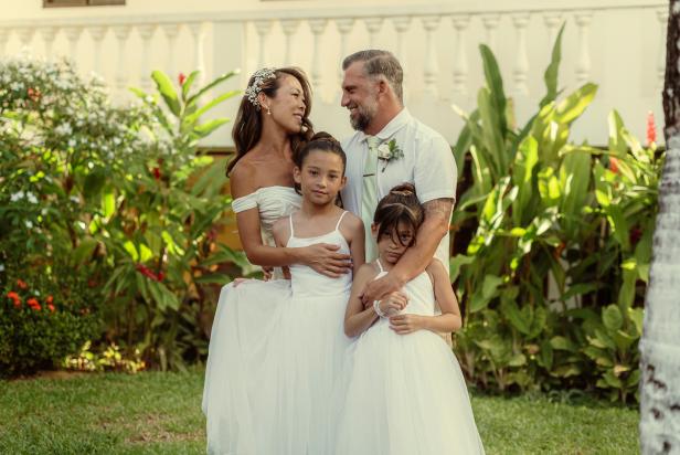 Luke Shantz and Steph Sitt on their wedding day with their daughters.