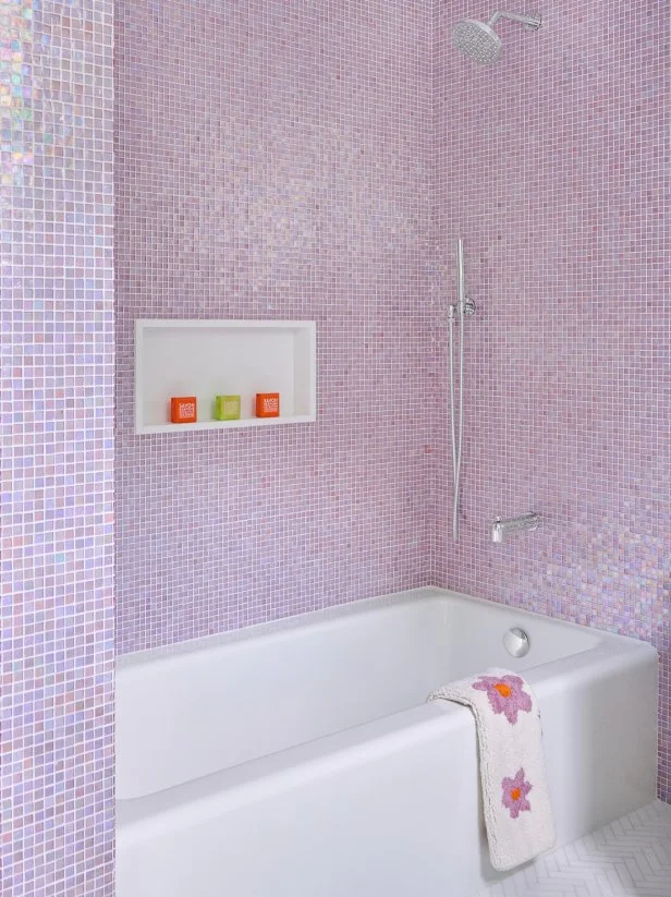 Shower With Lavender Tiles and a White Tub