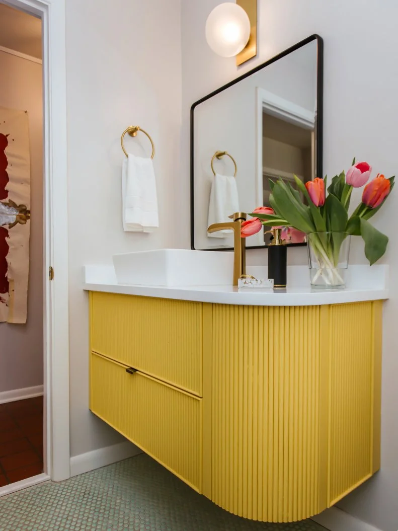 Simple White Powder Room With a Fluted Yellow Vanity