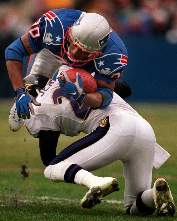 FOXBOROUGH, MA - JANUARY 2: Patriots wide receiver Troy Brown is up ended by Ravens cornerback DeRon Jenkins during the first quarter at Foxboro Stadium. (Photo by Matthew J. Lee/The Boston Globe via Getty Images)