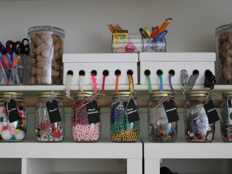 Craft Items in Jars on White Shelf 