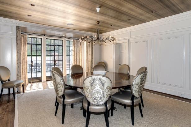 Dining Room with Silver Upholstered Chairs and Brown Table 