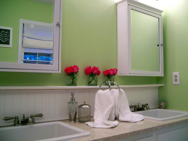 Green Bathroom With Double Vanity & Medicine Cabinets