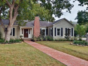 Grey/Green House with a Brick Chimney 