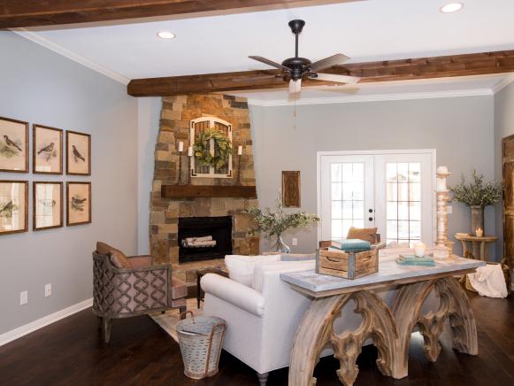Living room with Exposed Wood Beams and Stone Fireplace