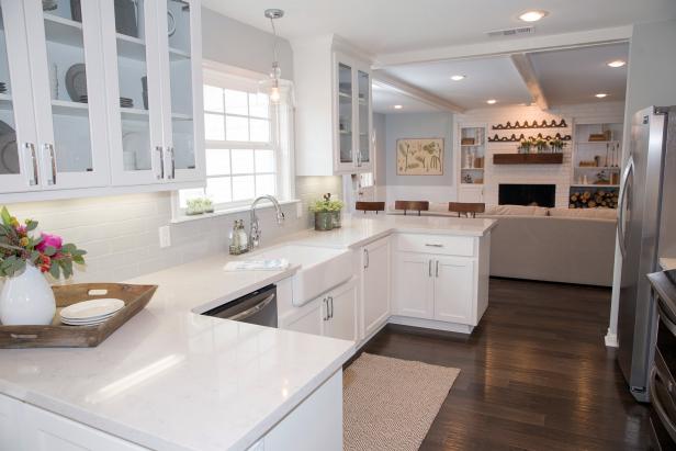 The new Blount kitchen is open to the dining room which flows into the living room creating an open, airy space. White cabinetry and countertops create a bright cooking space, as seen on Fixer Upper. (after, interior)